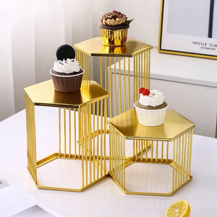 The iron table set up a table, snacks, fruits, dessert plates, and displayed iron frame flower stands