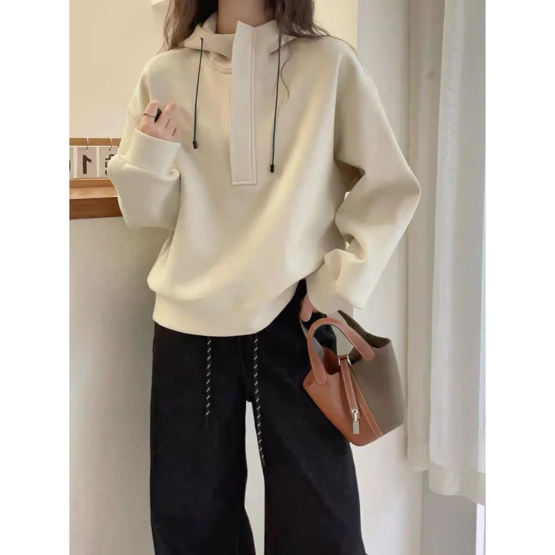 Koreańska wiosenno-jesienna bluza z kapturem w jednolitym kolorze, luźna, damska, codzienna i uniwersalna bluza wkładana przez głowę z długim rękawem.