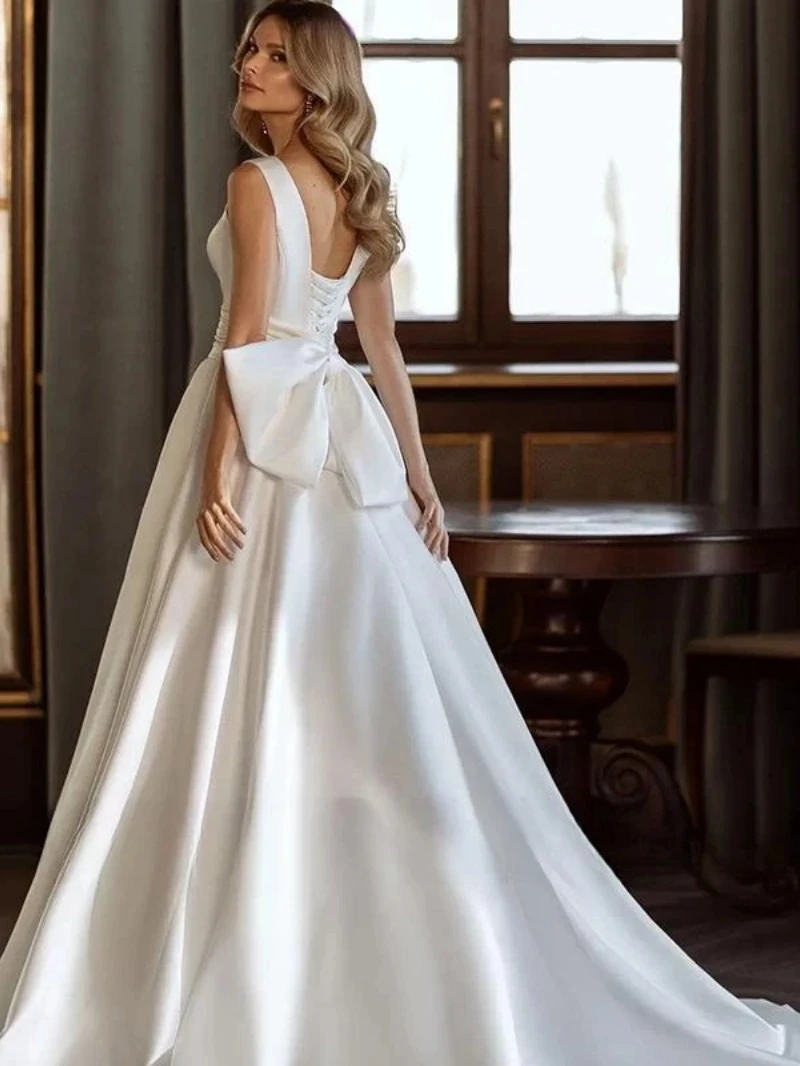 Abiti da sposa di moda moderna abiti da sposa in raso lucido fiocco decorare abito semplice con scollo a v Backless senza maniche Vestidos De Novia