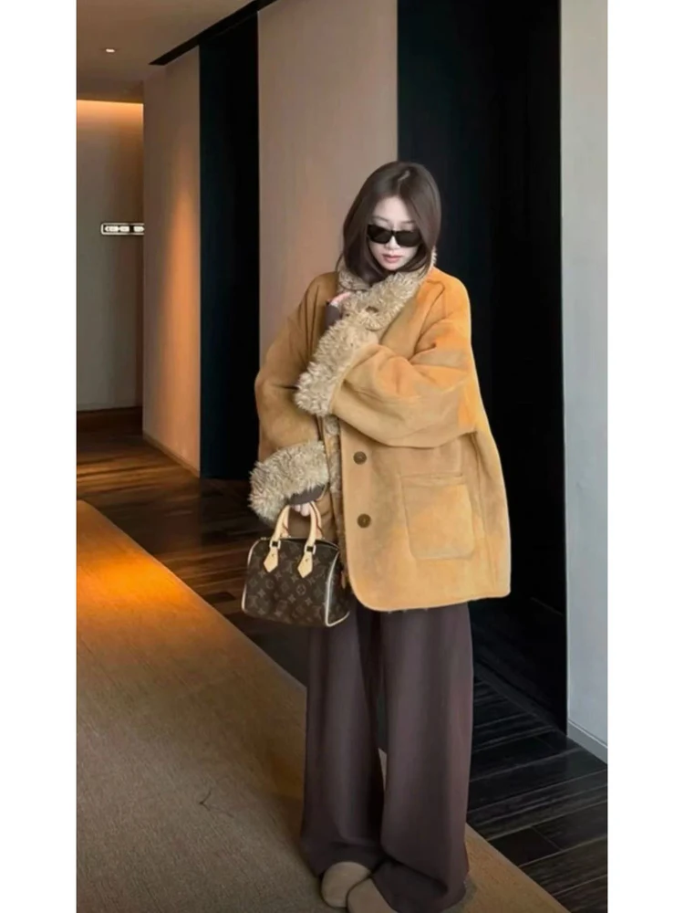 الرجعية Sle المرأة طويلة Sve Jaet فضفاضة تناسب زر واحد إغلاق الدافئة الجلد المدبوغ معطف فرو الضأن Dongda بوابة خمر الرياح