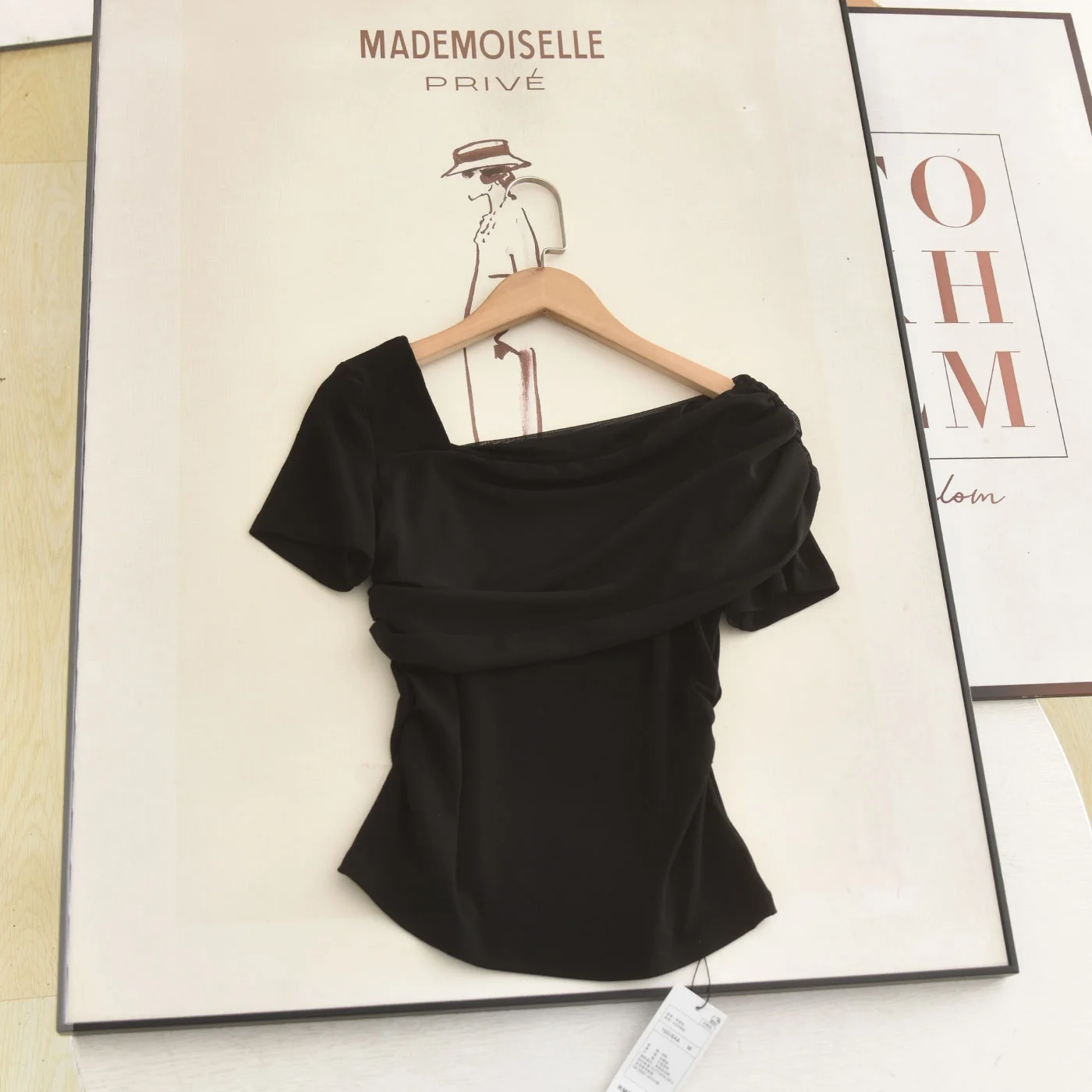 

Elegant Shoulder Bared Short Sleeve Slim Fit Black T Shirt Fashionable Design Ladies Top for Summer 2026 Stylish Casual Wear