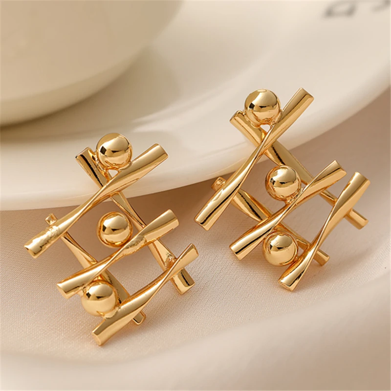 

2024 Fashion Cross Design Small Golden Ball Earrings Light Luxury High-end Irregular Earrings Girls Party Jewelry Gift