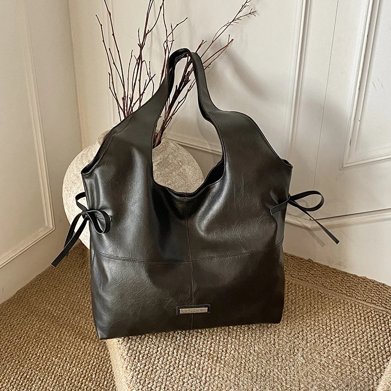 2025 Autunno/Inverno Tote casual di grande capacità Borse a tracolla in tinta unita con cerniera in PU Borse da viaggio quotidiane durevoli impermeabili