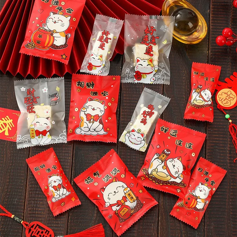 100 Uds patrón de gato de la suerte 2026 Año Nuevo Chino copo de nieve embalaje crujiente máquina para hornear galletas bolsas de regalo de dulces selladas