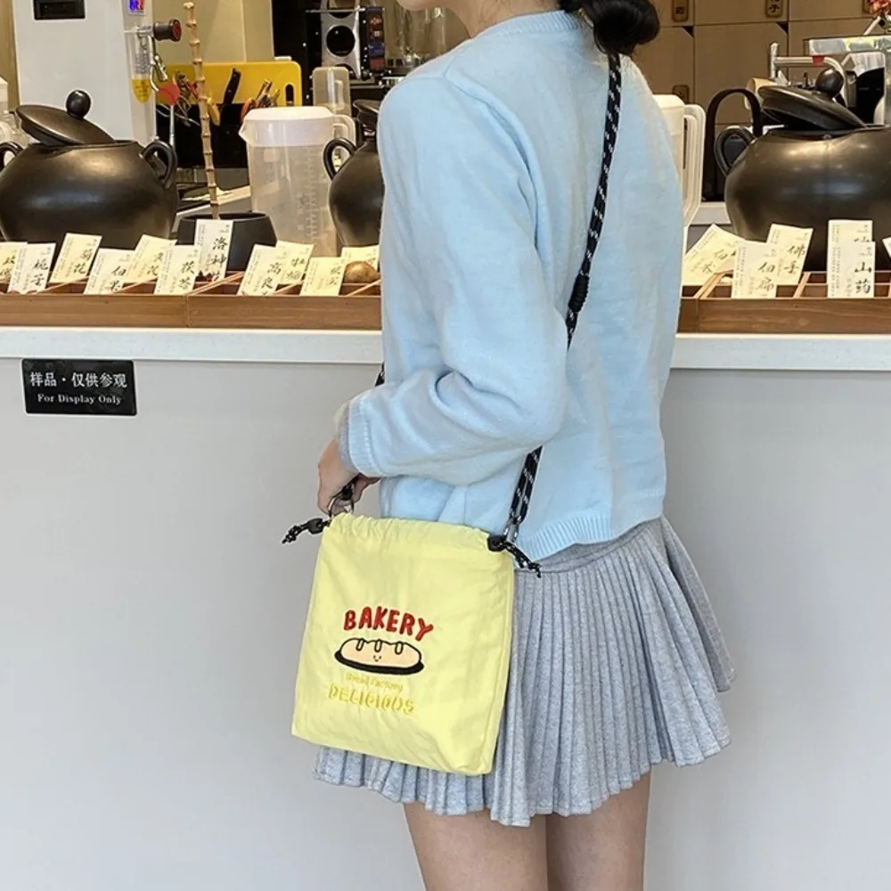 

Cartoon Nylon Shoulder Bag Embroidery Large Capacity Drawstring Crossbody Bag Solid Color Multicolor Mobile Phone Pack Daily