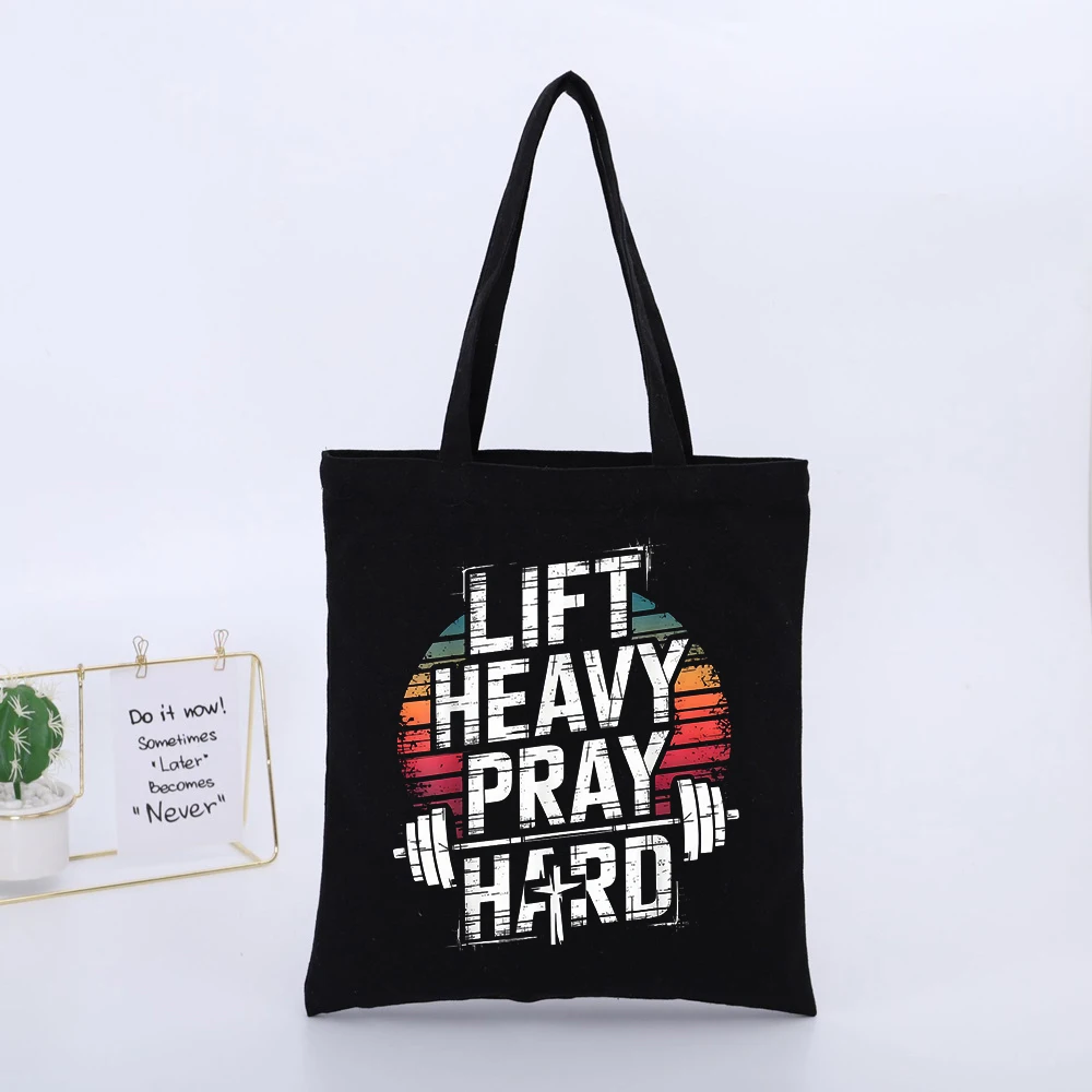 LIFT HEAVY PRAY HARD Black Canvas Tote Bag with Fitness-Inspired Typography Print, Retro Style for Gym and Daily Use