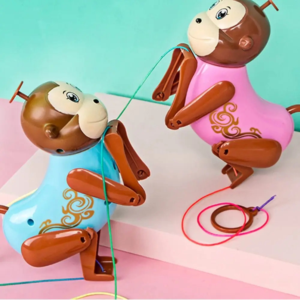 

Cartoon Pull-and-Climb Baby Monkey Toy Mechanical Pink/Blue Rope Climbing Monkey No Electricity Required Wind Up Monkey Toy