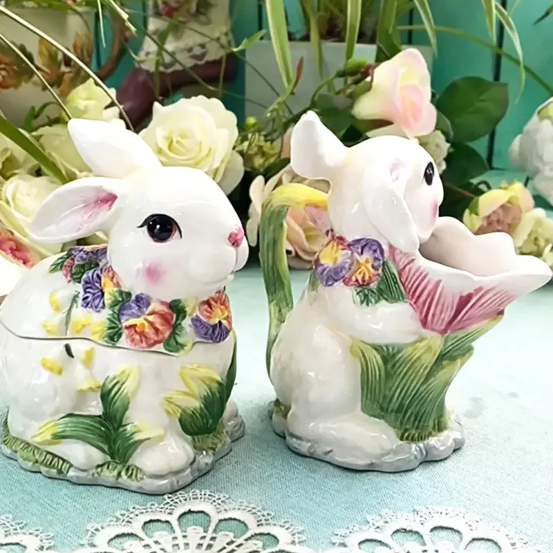 A pair of rabbit ornaments, rabbit milk jug, milk cup, biscuit jar, snack box.