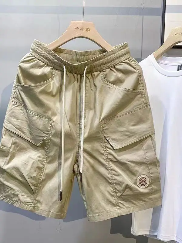 سراويل قصيرة عصرية للعمل للرجال صيفية بنمط جديد وسيم فضفاض بخصر مطاطي مستقيم الساق سراويل غير رسمية بخمسة أرباع