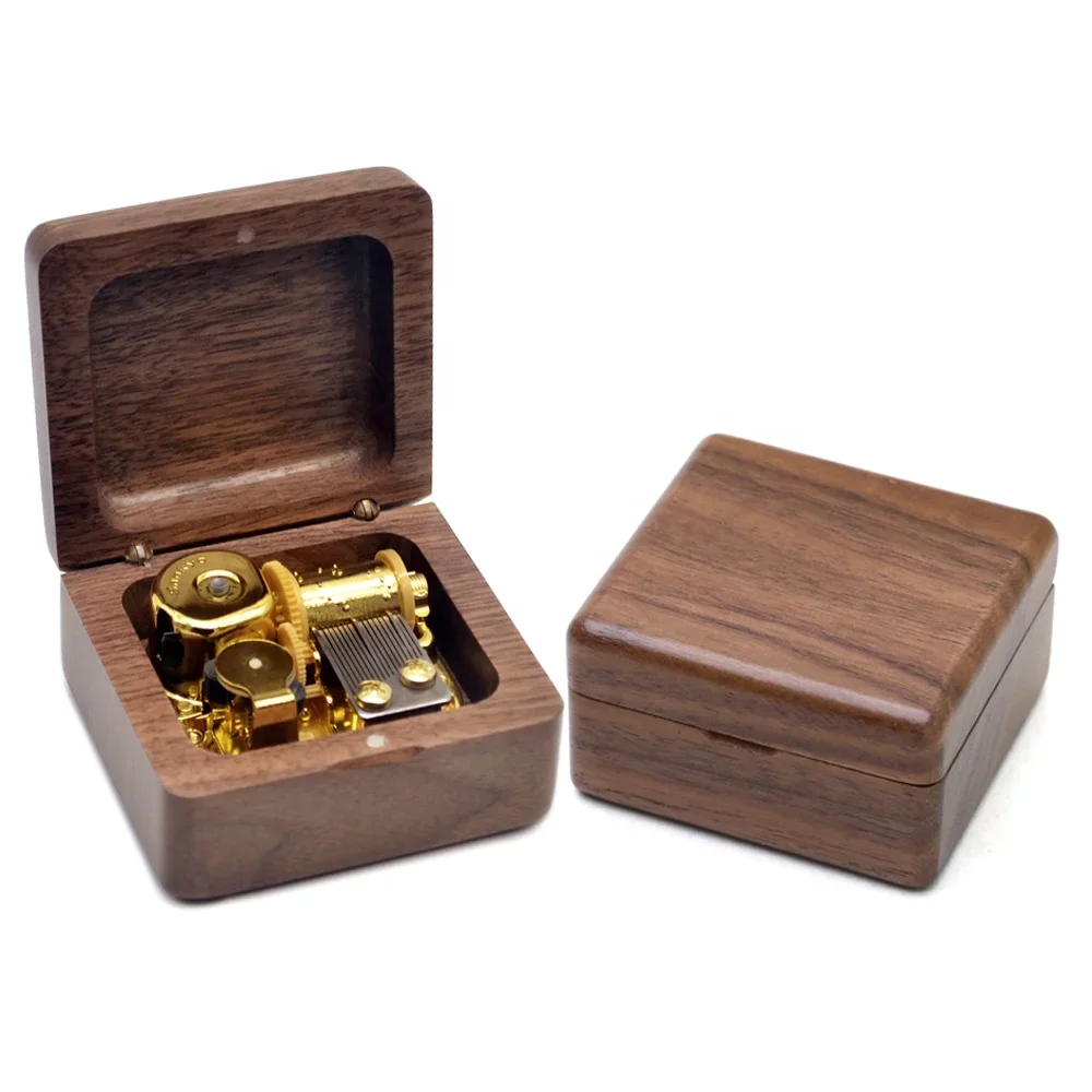 

Профессиональная оптовая музыкальная шкатулка из орехового дерева на заказ, резная игра из фильма на день рождения, поп-мелоди, музыка, креативный подарок для маркетинга