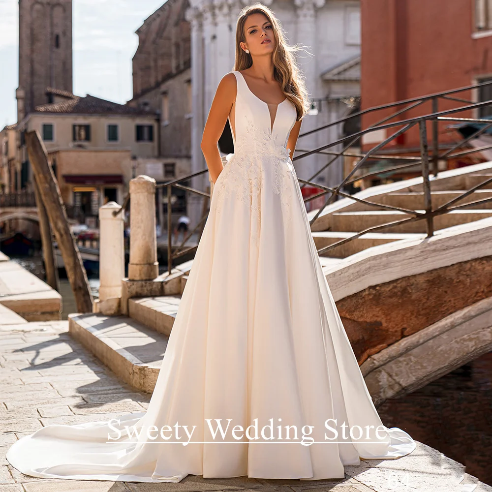 

A Line Wedding Dress Customized Sexy V Neck Sleeveless Pearls Applique Sweep Train Pocket Bridal Gown Robe De Mariee