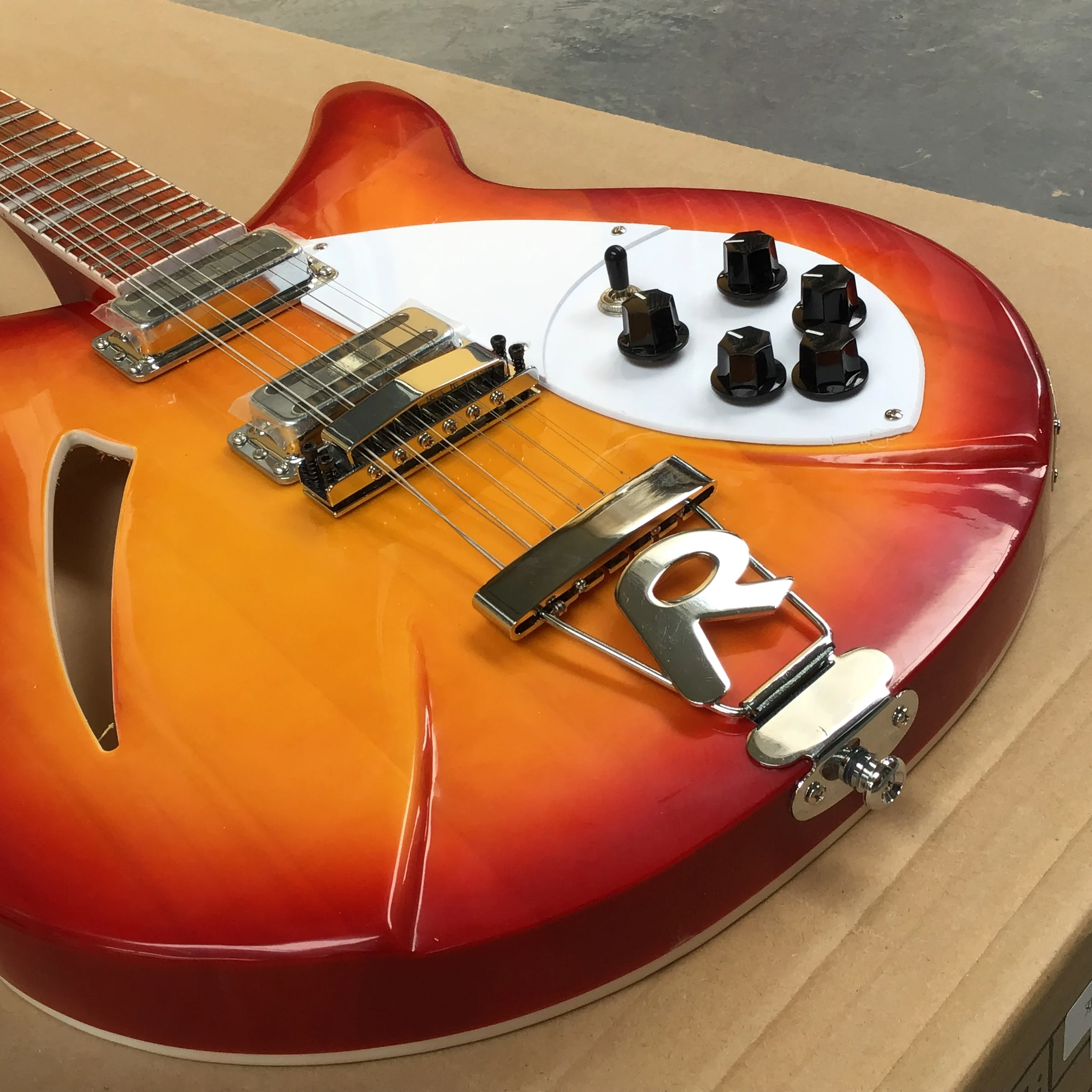 Half-hollow, orange, 12-string electric guitar