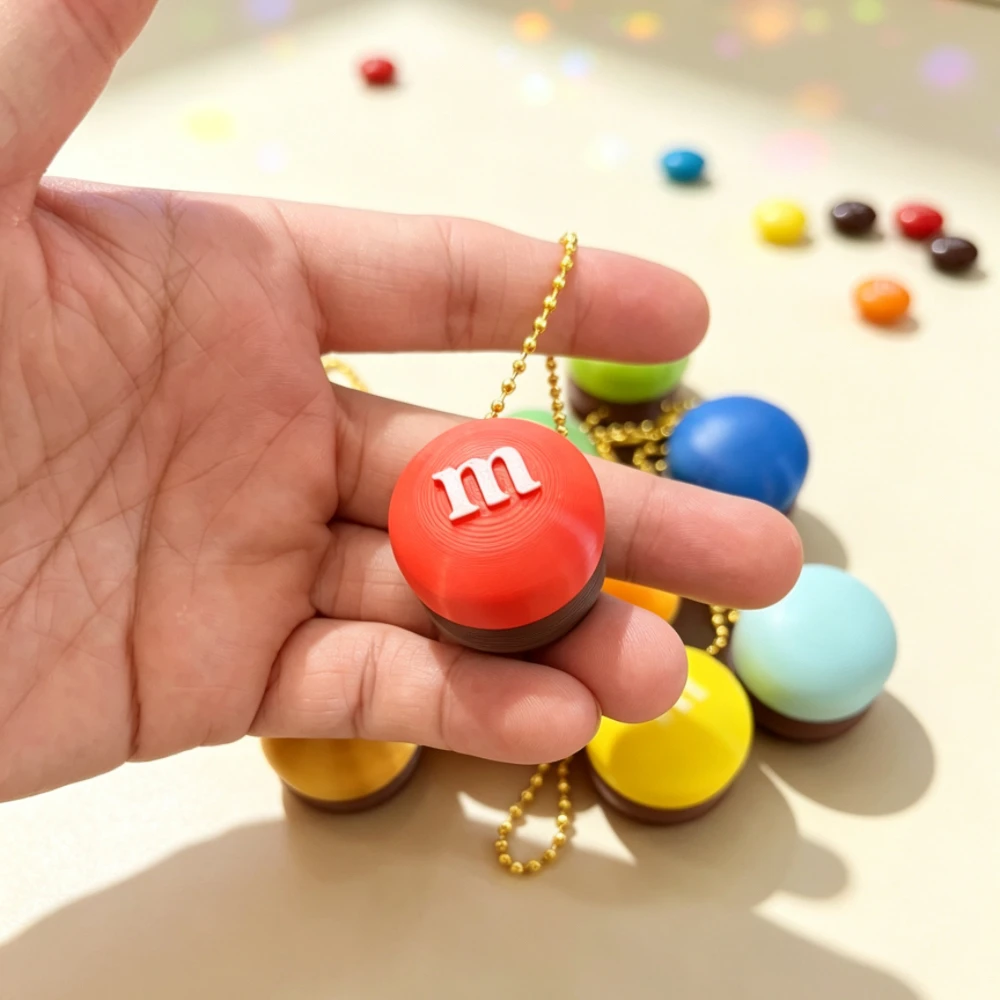 Cute M Bean 3D Printed Fidget Clicker Stress Relief Toy with Bag And Keychain Pendant - Fun Stress-Busting Accessory