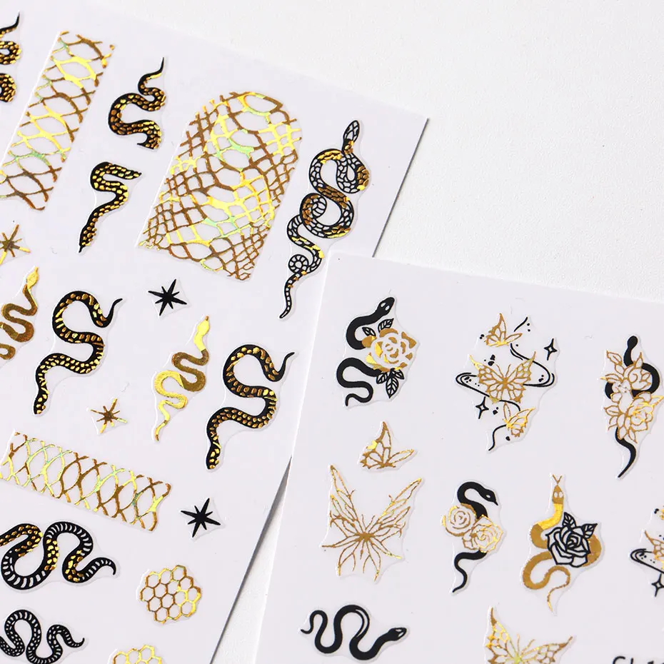สติกเกอร์ตกแต่งเล็บลายงูสีทองดำ 7 ชิ้น สติกเกอร์เล็บลายสัตว์พิมพ์ลายทอง 3 มิติ สไตล์ Y2K ลายดวงอาทิตย์ ดาว เรขาคณิต สไตล์ญี่ปุ่น
