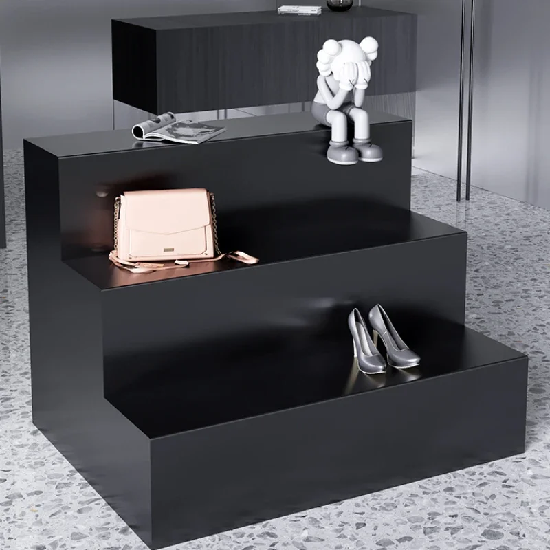 

In the clothing store, the island platform flowing water, creative modeling, shoe trapezoidal display table