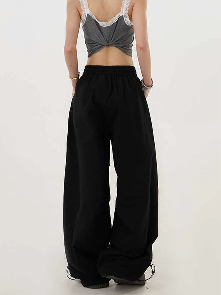 กางเกงทรงพาราชูทขาบานสไตล์ไฮสตรีทสำหรับผู้หญิง ฤดูใบไม้ร่วง-ฤดูหนาว 2025 รุ่น Y2K กางเกงขายาวทรงหลวมสไตล์ฮาราจูกุยุค 2000s แนวกรันจ์อเมริกันย้อนยุคทรงบอยแบงค์