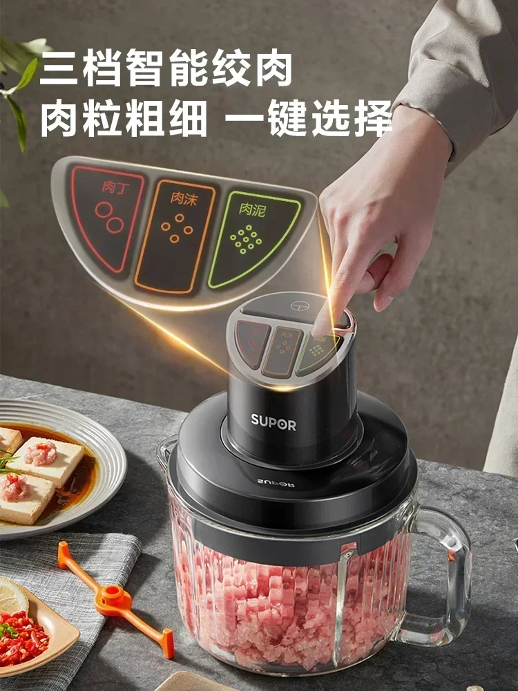 Household electric meat grinder. Small, automatic, multi-function. For minced meat, vegetables. Food supplement machine.