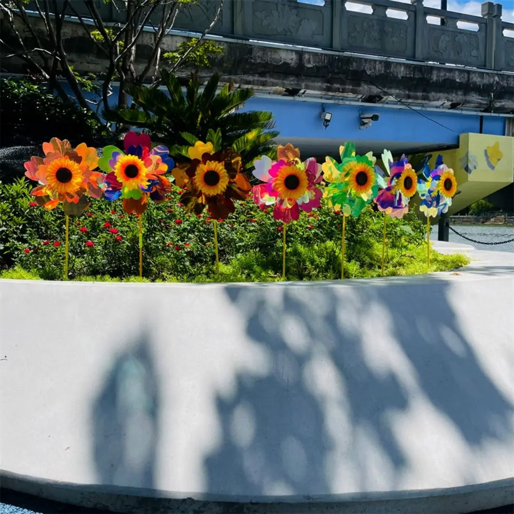 กังหันลมดอกทานตะวันหลากสไตล์ เปลี่ยนสีได้ ขนาด 32 ซม. หมุนได้ ทำจากพีวีซีสองชั้น เลเซอร์ระยิบระยับ