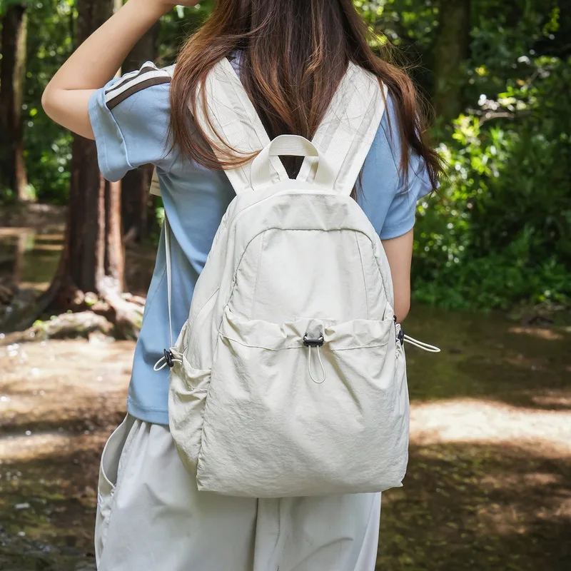Korean-style college-style lightweight nylon drawstring backpack for female students, suitable for commuting, laptop, school, sp