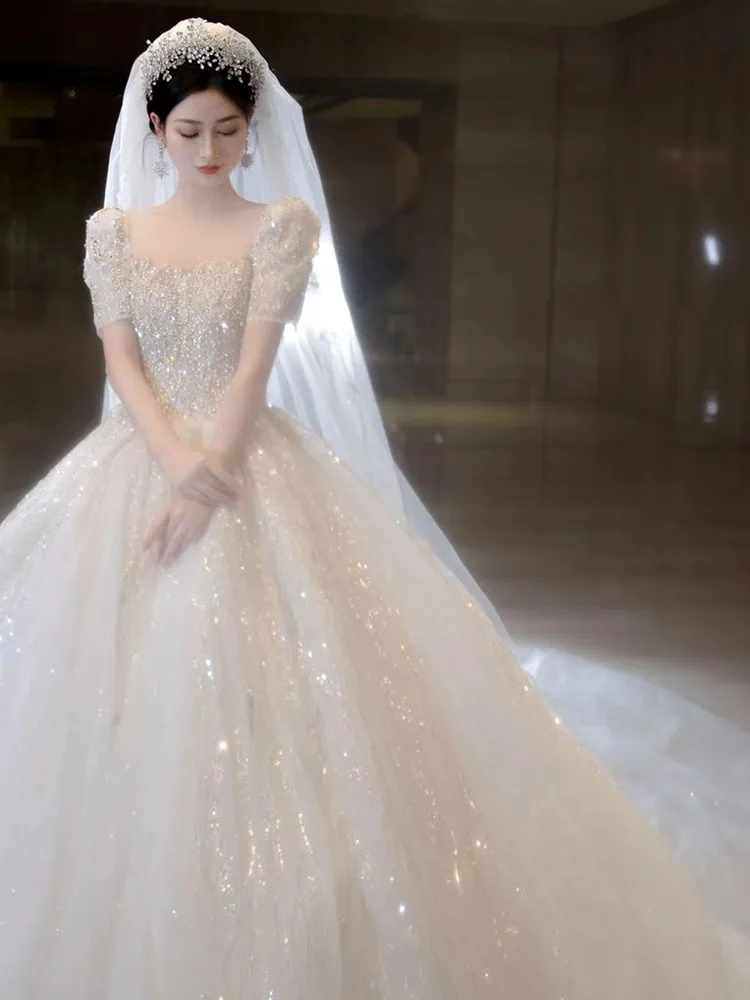 Abito da sposa con perline a maniche corte 2023 nuovo lusso grande treno abiti da sposa abito da ballo in tulle abiti da sposa Vestido De Noiva