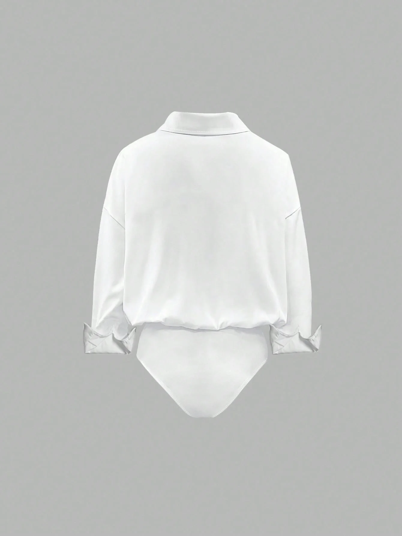 Oversized solid-colored jumpsuit with long sleeves in a versatile shirt style