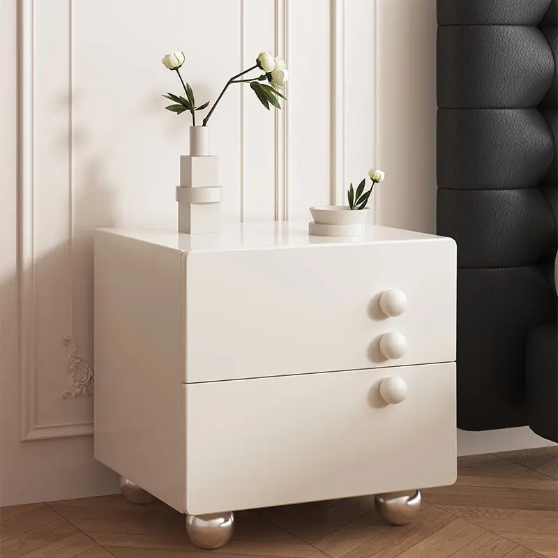 

Cream wind bedside table simple modern luxury bedroom solid wood bedside cabinet simple high sense storage locker.