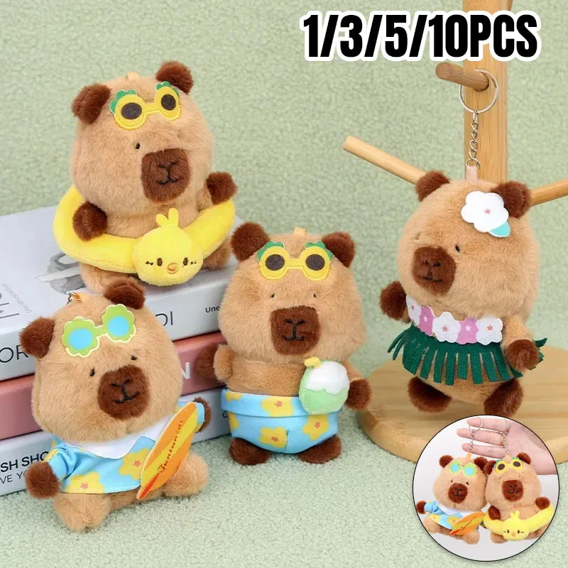 Entzückender 13 cm großer Capybara-Schlüsselanhänger, Plüschtier, der hawaiianische Schwimmring, Sommer, Strand, Stofftier, Geschenk mit Skateboard-Zubehör trägt