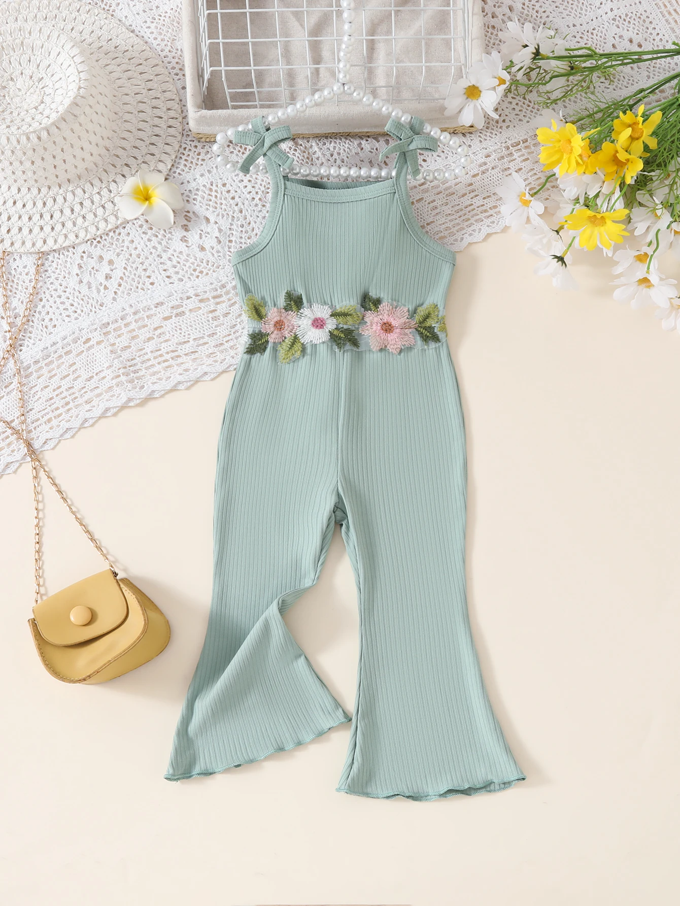 Baby girl's floral appliqué decorated halter with bow flared pants romper