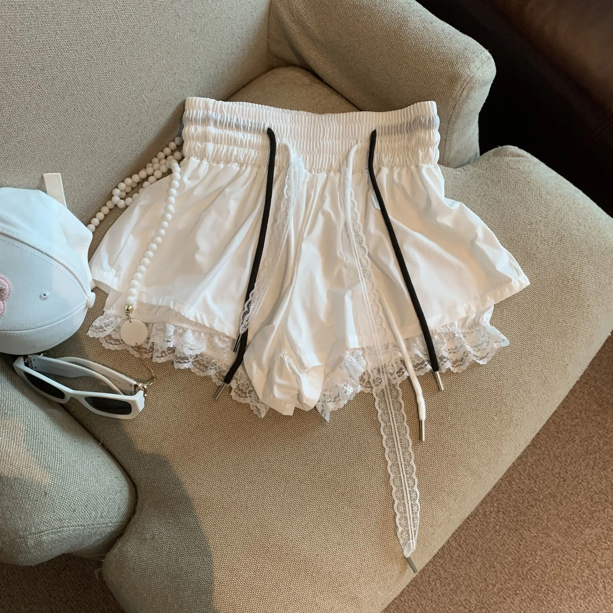 Pantalones cortos de encaje de dos piezas falsos de retazos para mujer, pantalones cortos informales en forma de A con cordón de cintura alta elástica