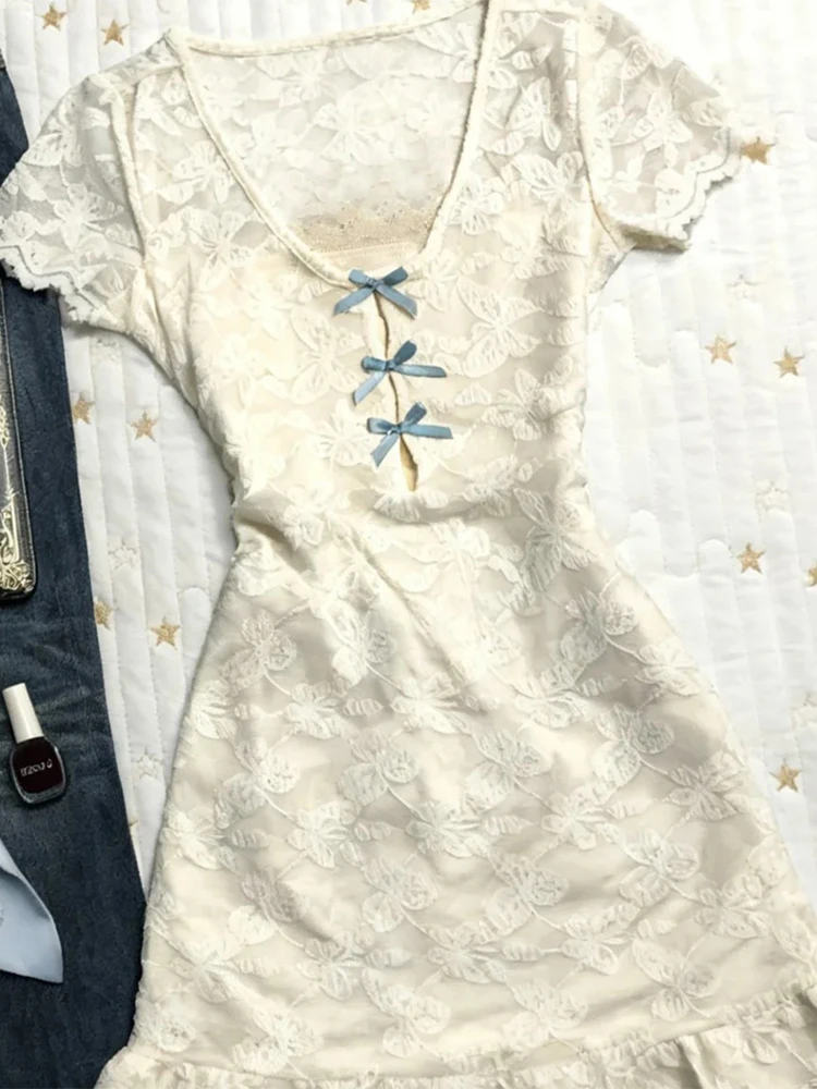 Oryginalna, vintage'owa koronkowa spódnica z kokardą w talii, dekoltem w serek lub okrągłym, damska spódnica bazowa, krój A, codzienna, elegancka.