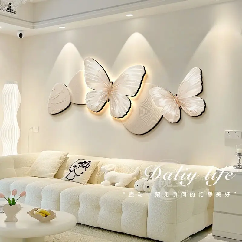 Cream style living room decoration with butterfly French sofa background and wall lights for a luxurious feel