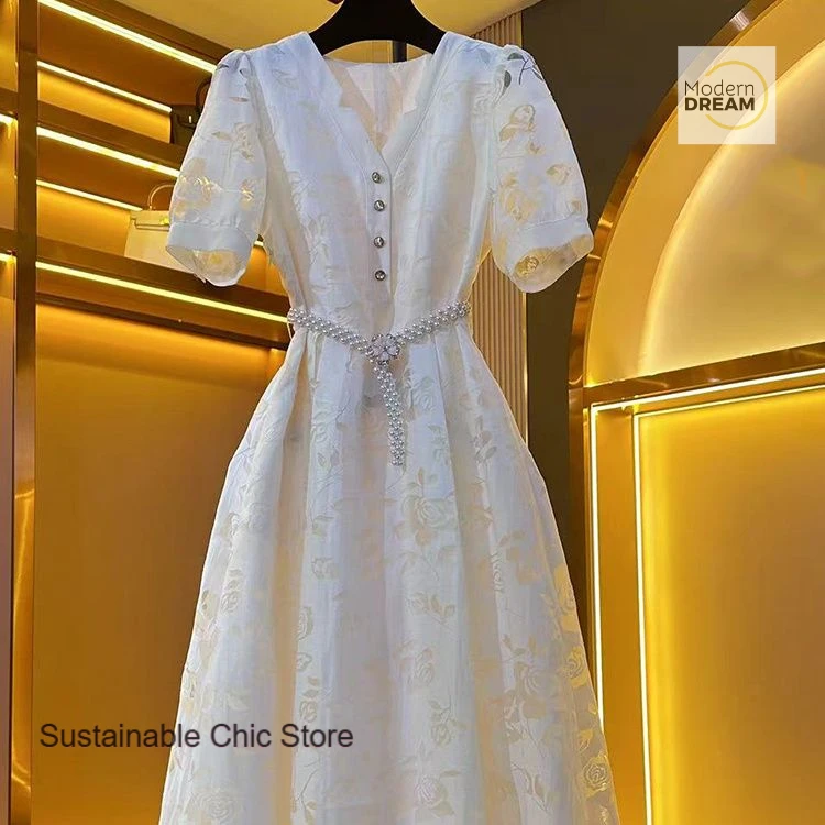 

French white unique temperament design high sense dress new women's summer new fashion chic small fragrance casual skirt.