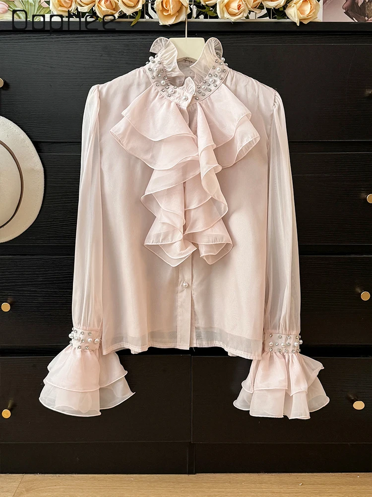 Camisa de manga acampanada con cuello levantado y perlas de gama alta de estilo francés para mujer otoño 2025 Top elegante de moda con una sola botonadura