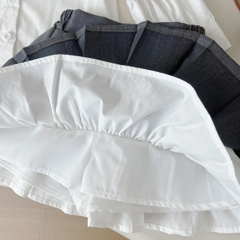 A.Girls' الربيع والخريف تنورة عصرية جديدة على طراز الكلية محبوك سترة قميص مجموعة من ثلاث قطع