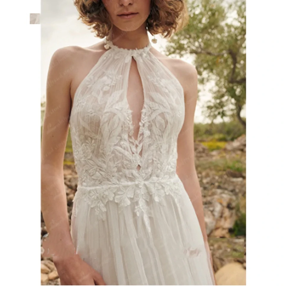 Seksowne koronkowe suknie ślubne na plażę z dekoltem typu halter, odkrytymi plecami, długości do podłogi, w kształcie litery A, z trenem, tiulowe aplikacje, suknia ślubna 2025