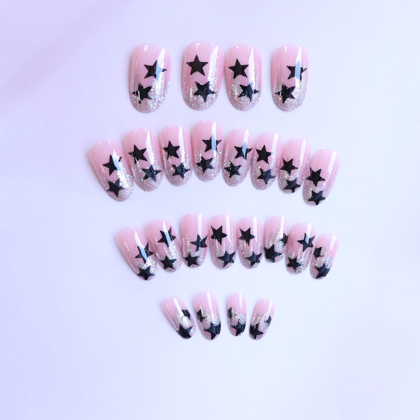 24pcs Medium pink almond full cover star fake nails, black five-pointed stars, Glitter, 1 nail file and 1 Jelly gel whitening n