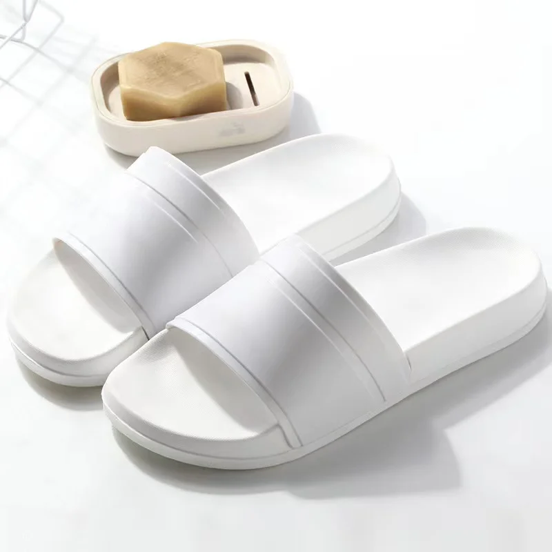 Large size slippers for men in hotels and guesthouses. Summer indoor minimalism, stay at home, take a shower in the bathroom, an