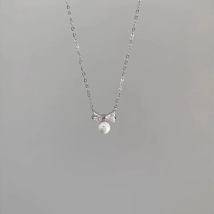 

Butterfly Knot Pearl Necklace S925 Pure Silver Niche Design High-end Sparkling Diamond Collarbone Chain New Trend