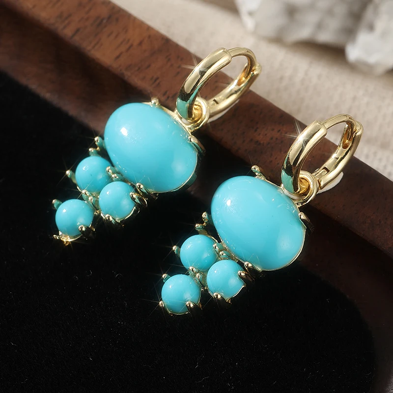 Blaue synthetische Edelstein-Ohrhänger mit Perlen-Inlay, vergoldete Tropfenohrringe für Damen, Party-Mode-Schmuck.