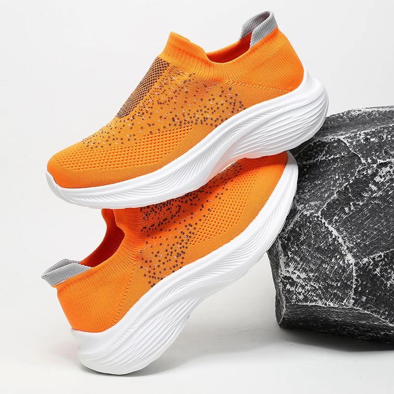 A pair of unisex teens rhinestone knit slip-on shoes elastic breathable upper cushioned casual sneakers KM-063