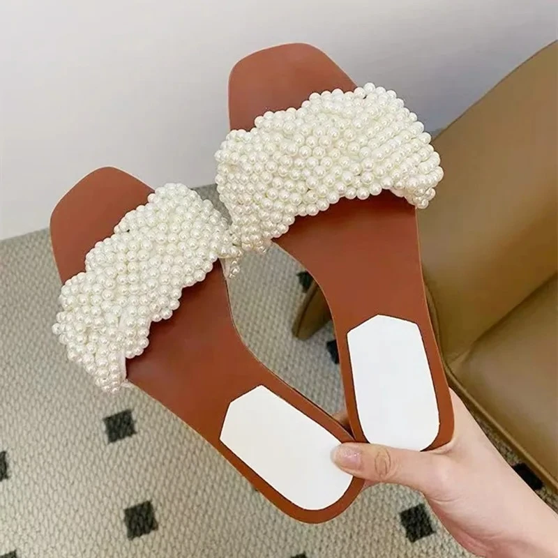 

Novelty White String Bead Flat Slippers Women Pearl Weaving Designer Slide Sandals Summer Open Toe Comfortable Beach Casual Shoe