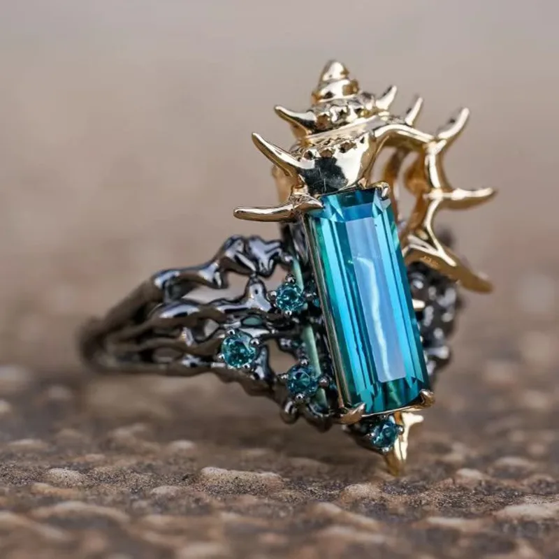 

Coral Blue Crystal Set with Zircon Hollow Two tone Open Adjustable Marine Life Conch Ring