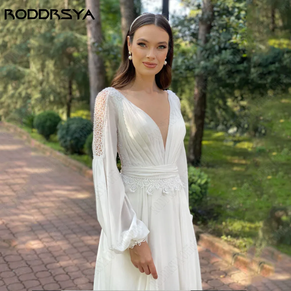 RODDRSYA Boho V-hals Chiffon Bruidsjurk Plus Size Backless Lange Puff Mouwen Kant Bruidsjurk A-LiRODDRSYA Boho V-hals chiffon trouwjurk plus maat rugloze lange pofmouwen kant bruidsjurk A-lijn grote maat Düğün elbisesi