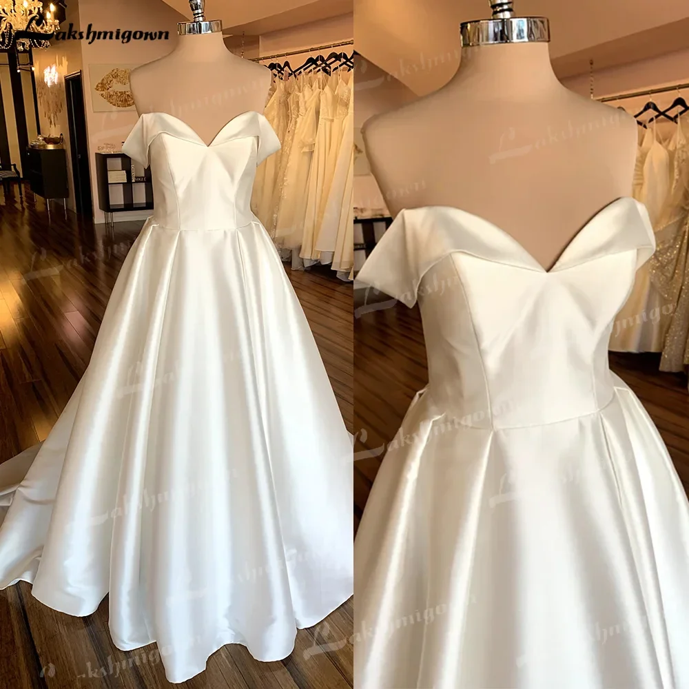 Una línea de vestidos de novia con hombros descubiertos, tren capilla, hecho a medida, satén, escote en forma de corazón, vestidos de novia elegantes, formalesдебное пла