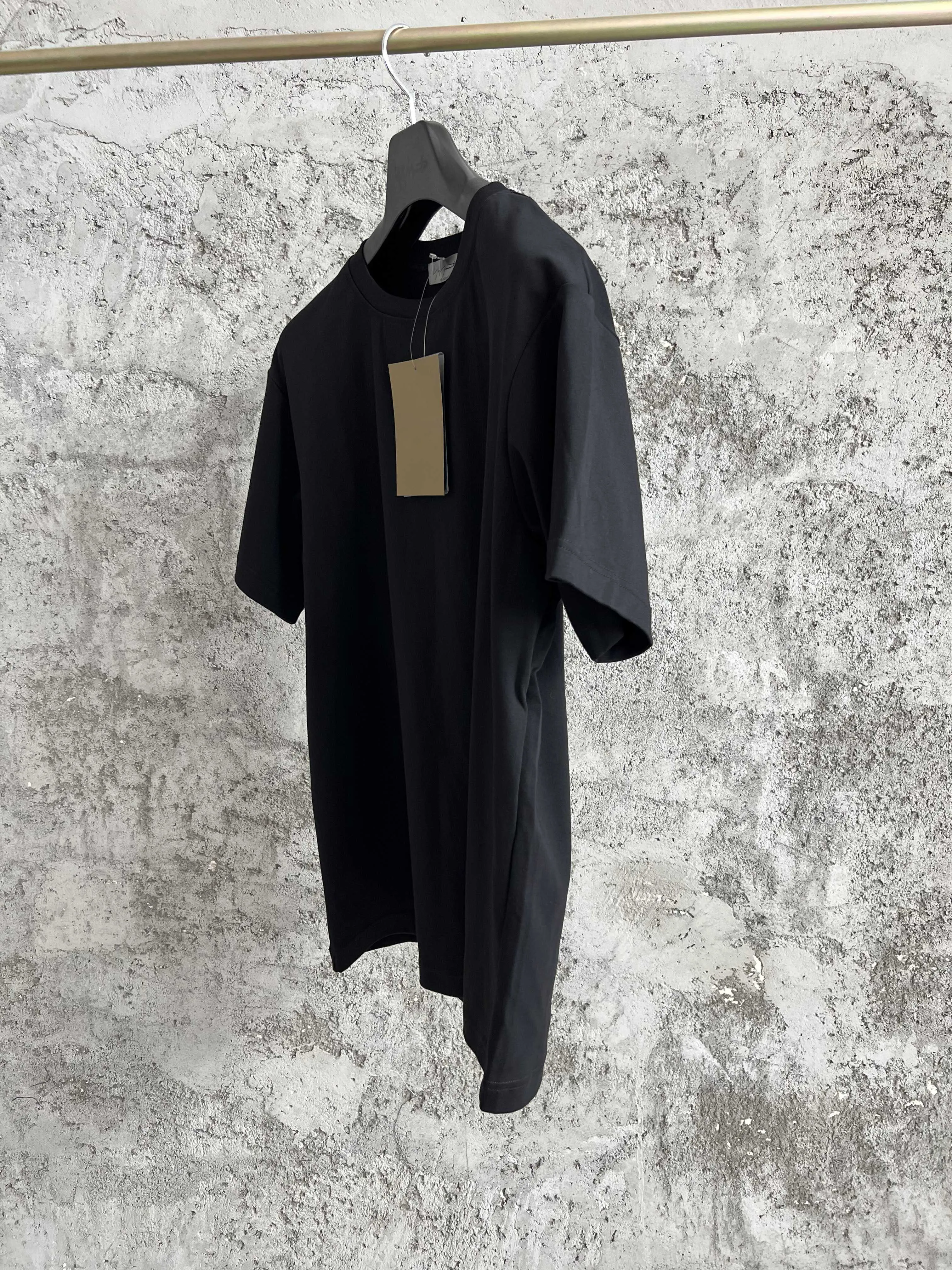 

A loose, pure cotton, asymmetrical black long-sleeved T-shirt hoodie for men