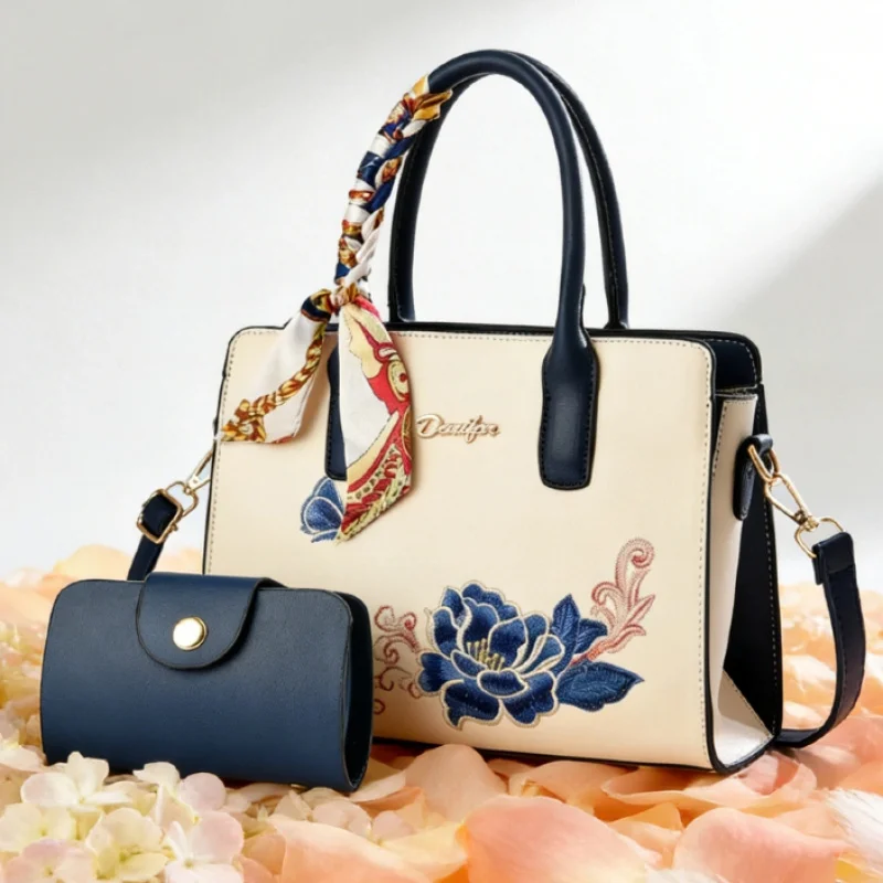 For a birthday gift, consider giving your mom a 2-piece set of handbags, including an embroidered handbag and a cross-body bag.