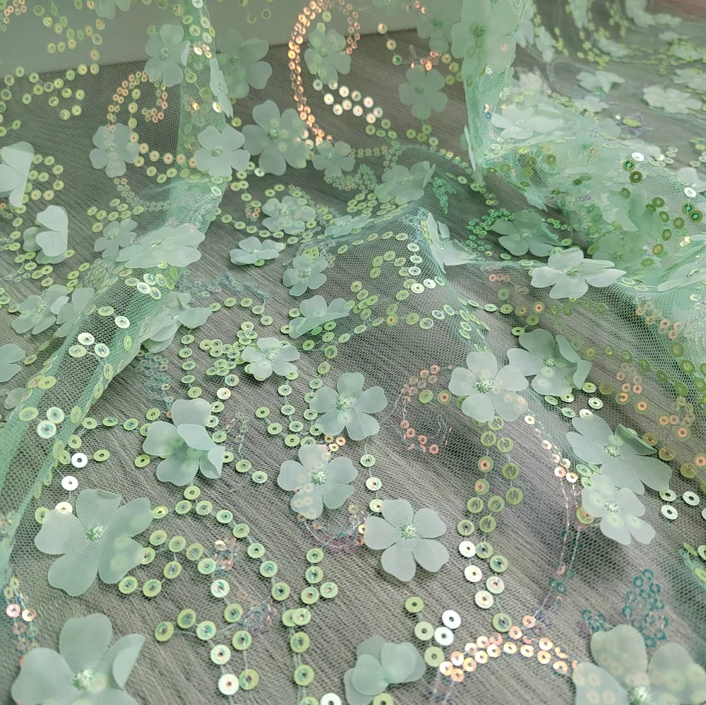 

Beautiful light green 3D embroidered tulle fabric with sequins is used for wedding dresses Home décor sewing fabrics
