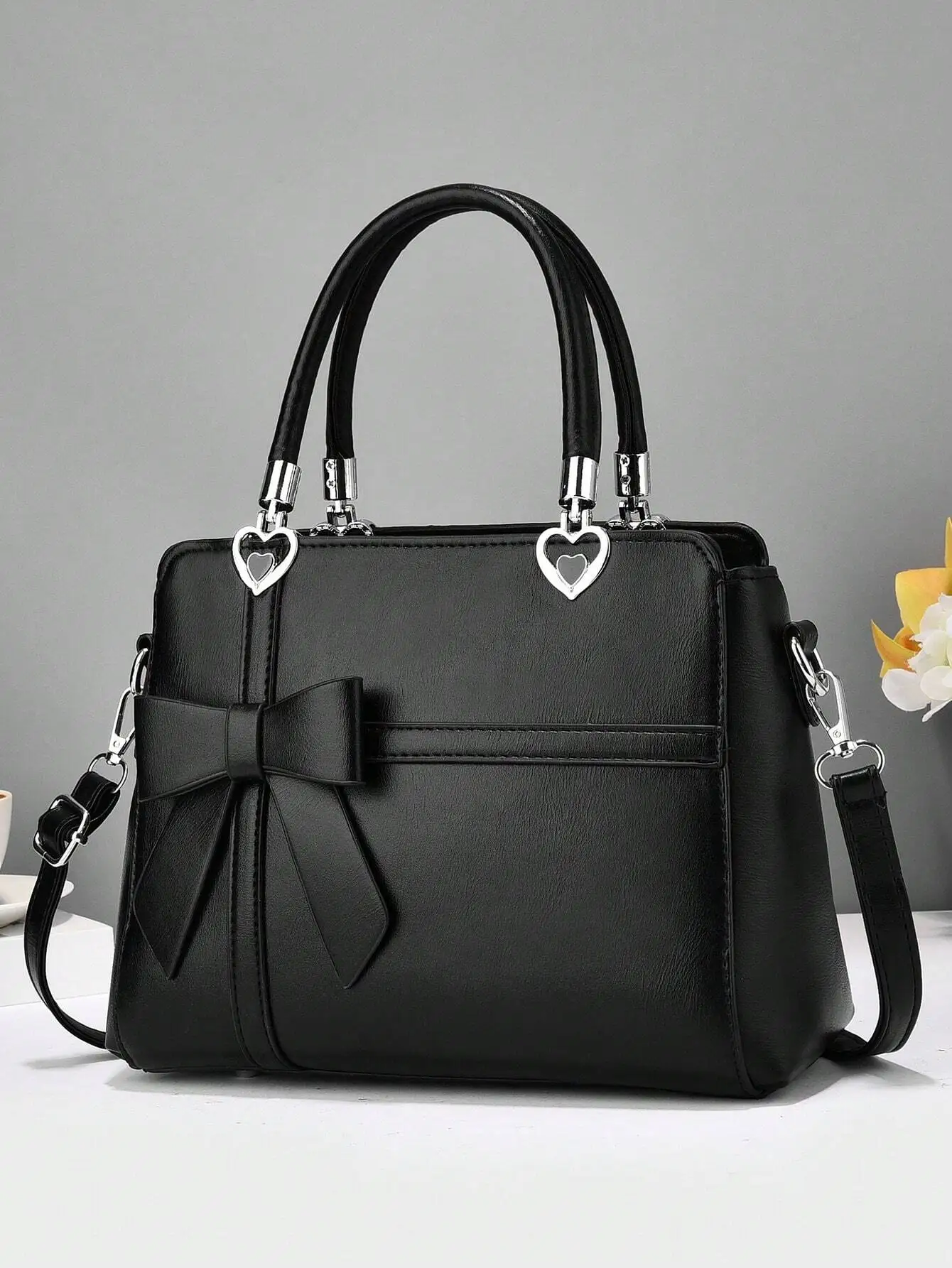 

Black Faux Leather Top-Handle Handbag with Bow & Heart Charms