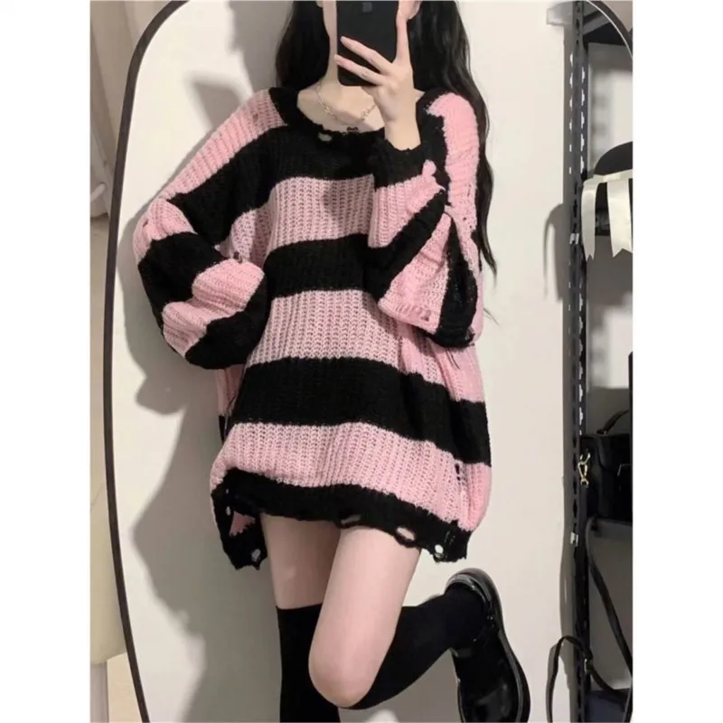 Hole-torn sweater Korean version of striped trend loose pullover wears lazy long sweater in autumn and winter new style.