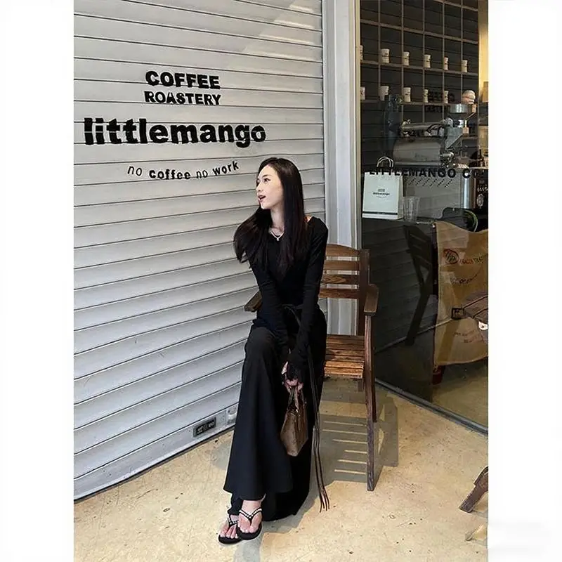 Modna, uniwersalna, wyszczuplająca spódnica w kształcie litery A, długa, damska, w stylu francuskim, niszowa, z wysokim stanem, zwisająca, do połowy łydki.